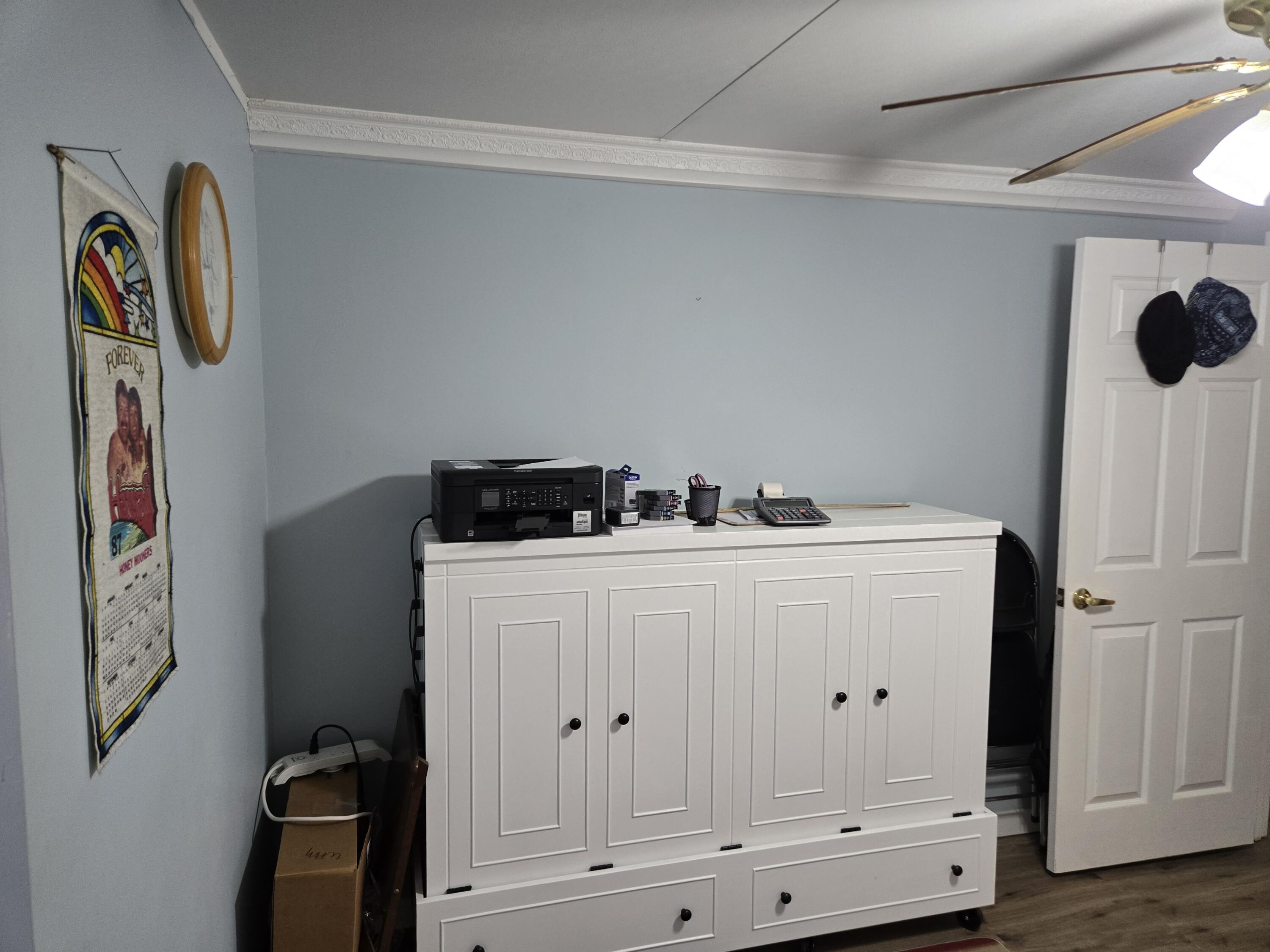 12240 Southeast 138th Avenue, Unit 225 Okeechobee, FL 34974 - Photo 26 of 50 a view of storage and utility room with wooden floor