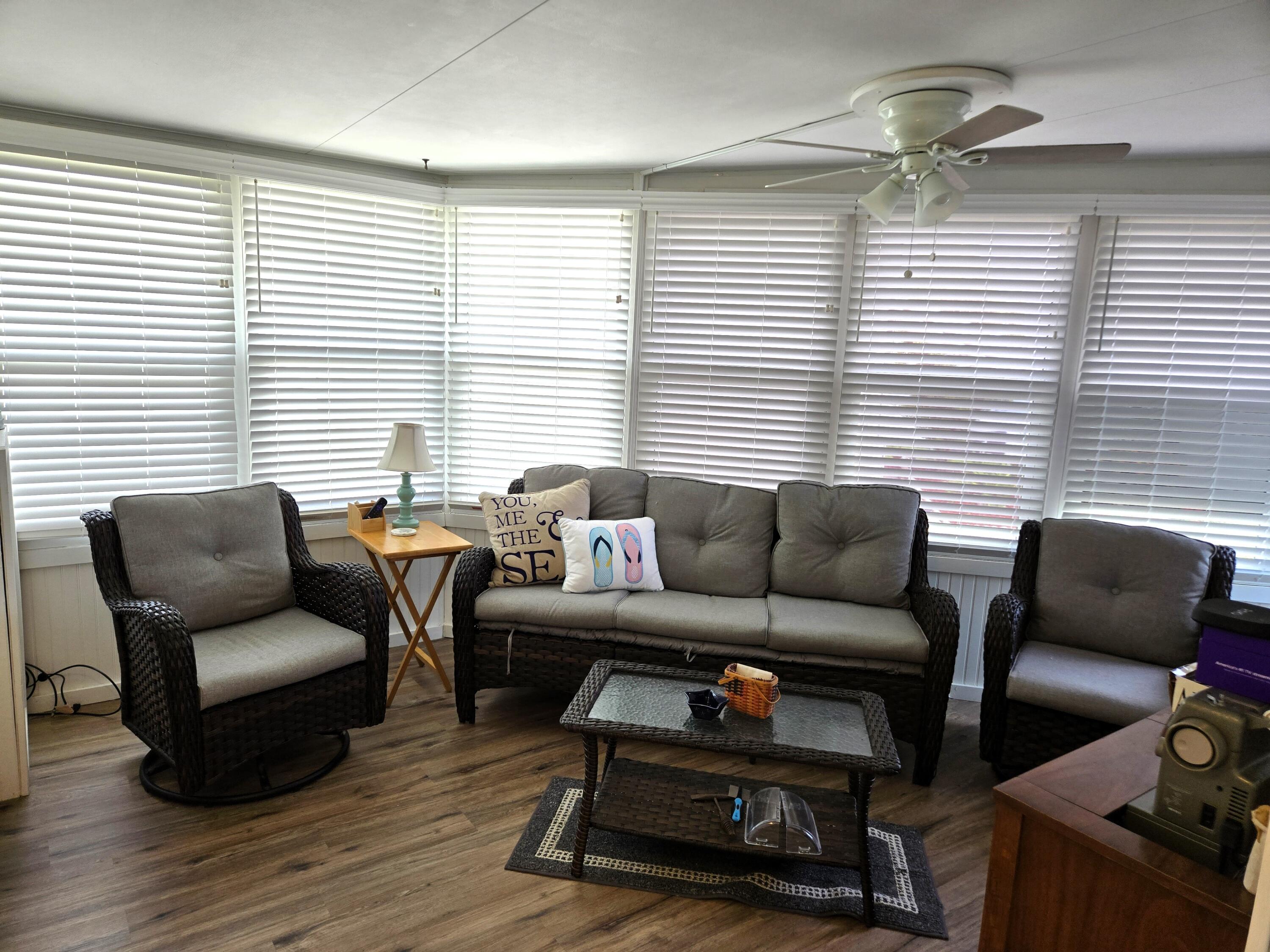 12240 Southeast 138th Avenue, Unit 225 Okeechobee, FL 34974 - Photo 28 of 50 a living room with furniture and a window