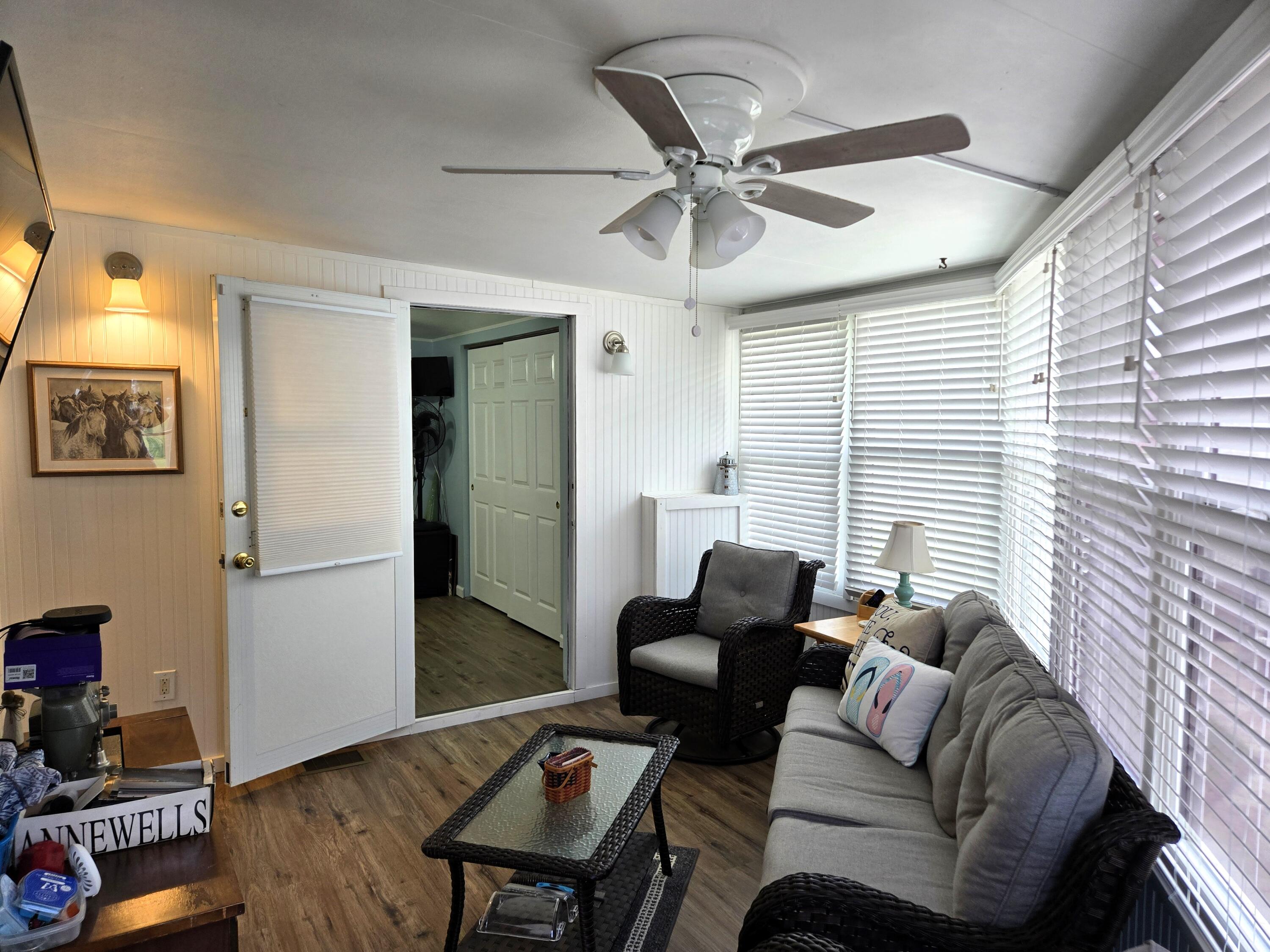 12240 Southeast 138th Avenue, Unit 225 Okeechobee, FL 34974 - Photo 29 of 50 a living room with furniture and a window