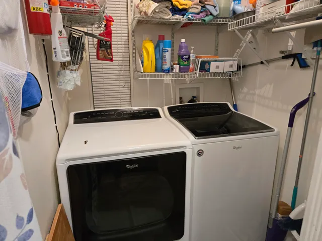 a utility room with dryer and washer