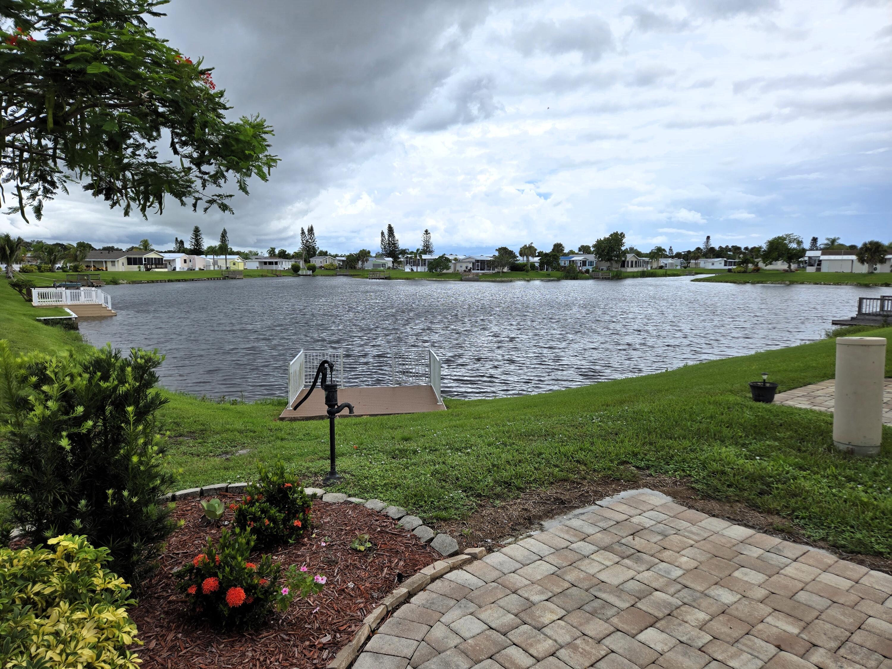 12240 Southeast 138th Avenue, Unit 225 Okeechobee, FL 34974 - Photo 32 of 50 a view of a lake with a garden