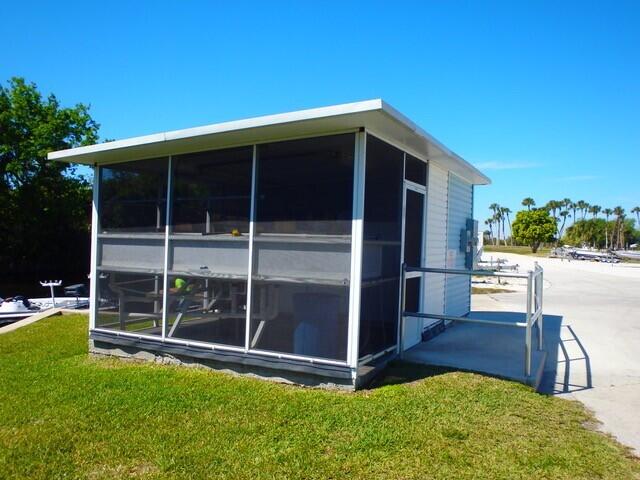 12240 Southeast 138th Avenue, Unit 225 Okeechobee, FL 34974 - Photo 48 of 50 a view of an house with backyard space and balcony