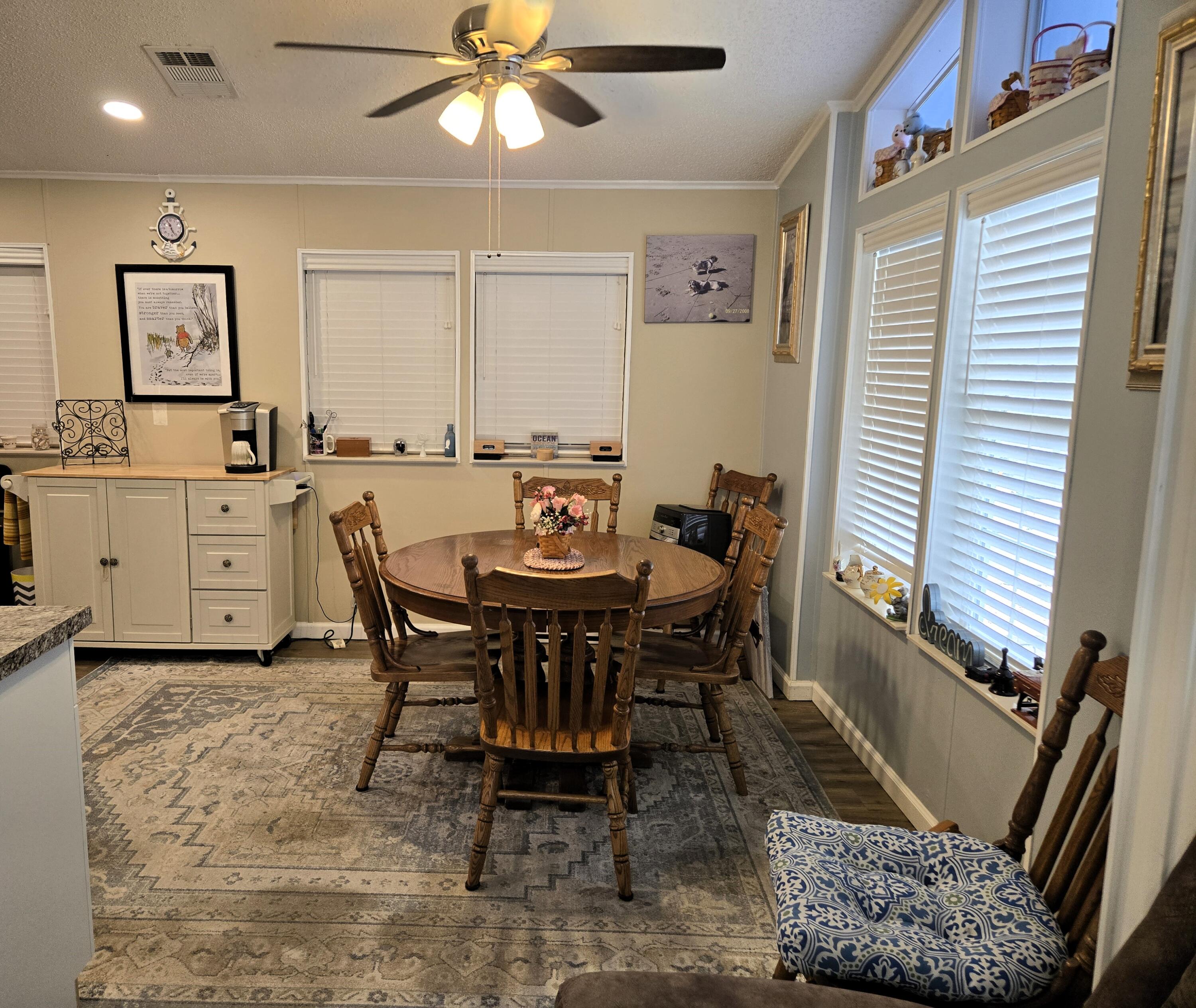 12240 Southeast 138th Avenue, Unit 225 Okeechobee, FL 34974 - Photo 6 of 50 a view of a dining room with furniture
