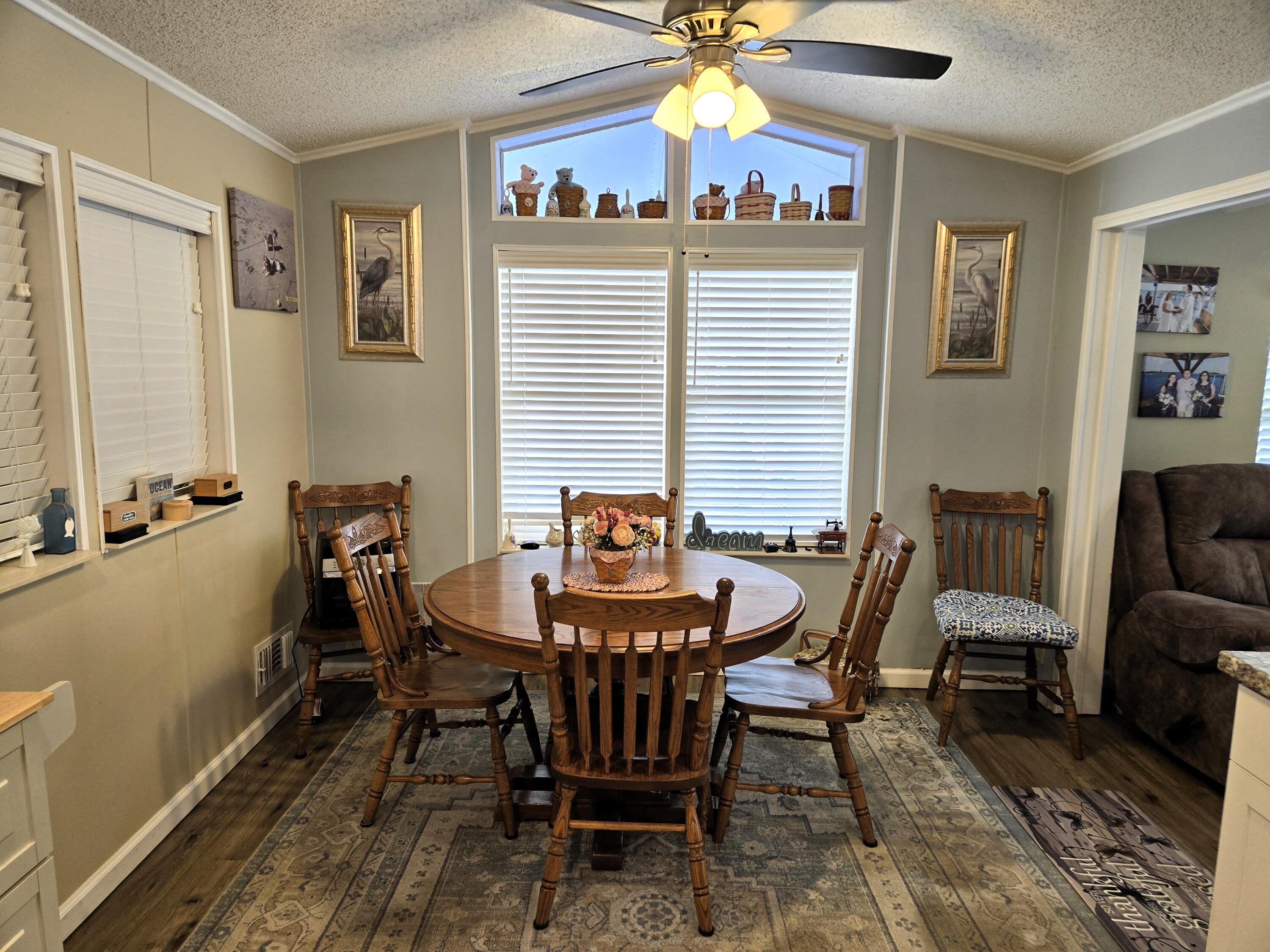 12240 Southeast 138th Avenue, Unit 225 Okeechobee, FL 34974 - Photo 7 of 50 a view of a dining room with furniture