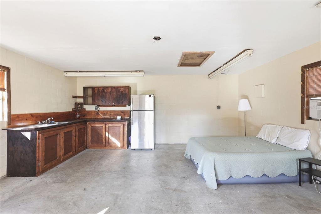 244 Angeles Road DeBary, FL 32713 - Photo 39 of 41 a spacious bedroom with a bed and a cabinets