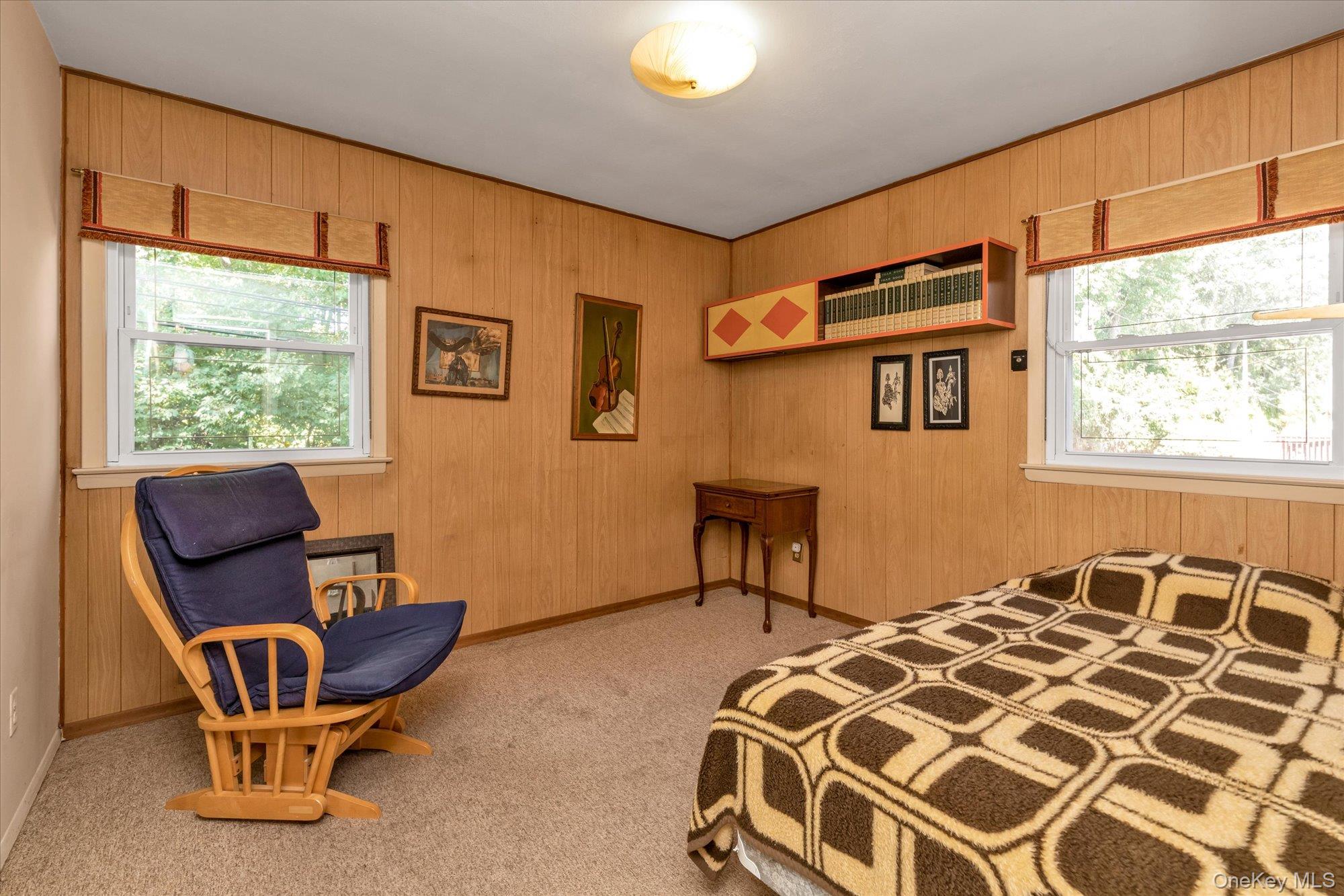 180 Dogwood Road Roslyn, NY 11576 - Photo 11 of 21 a bedroom with a chair and a window