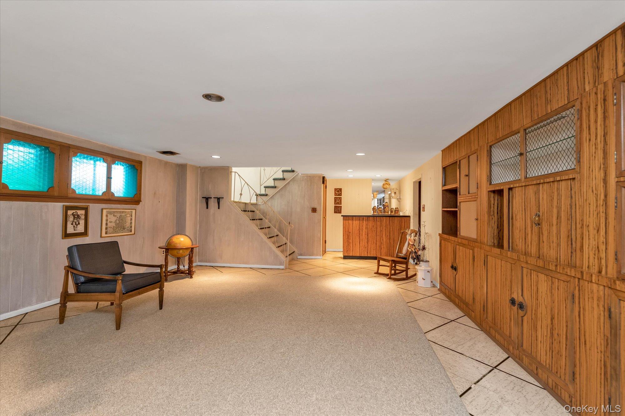 180 Dogwood Road Roslyn, NY 11576 - Photo 15 of 21 a view of a livingroom with furniture and a chair