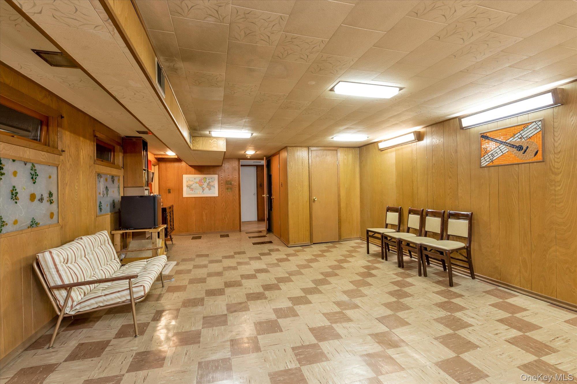 180 Dogwood Road Roslyn, NY 11576 - Photo 17 of 21 a view of a hallway with chairs