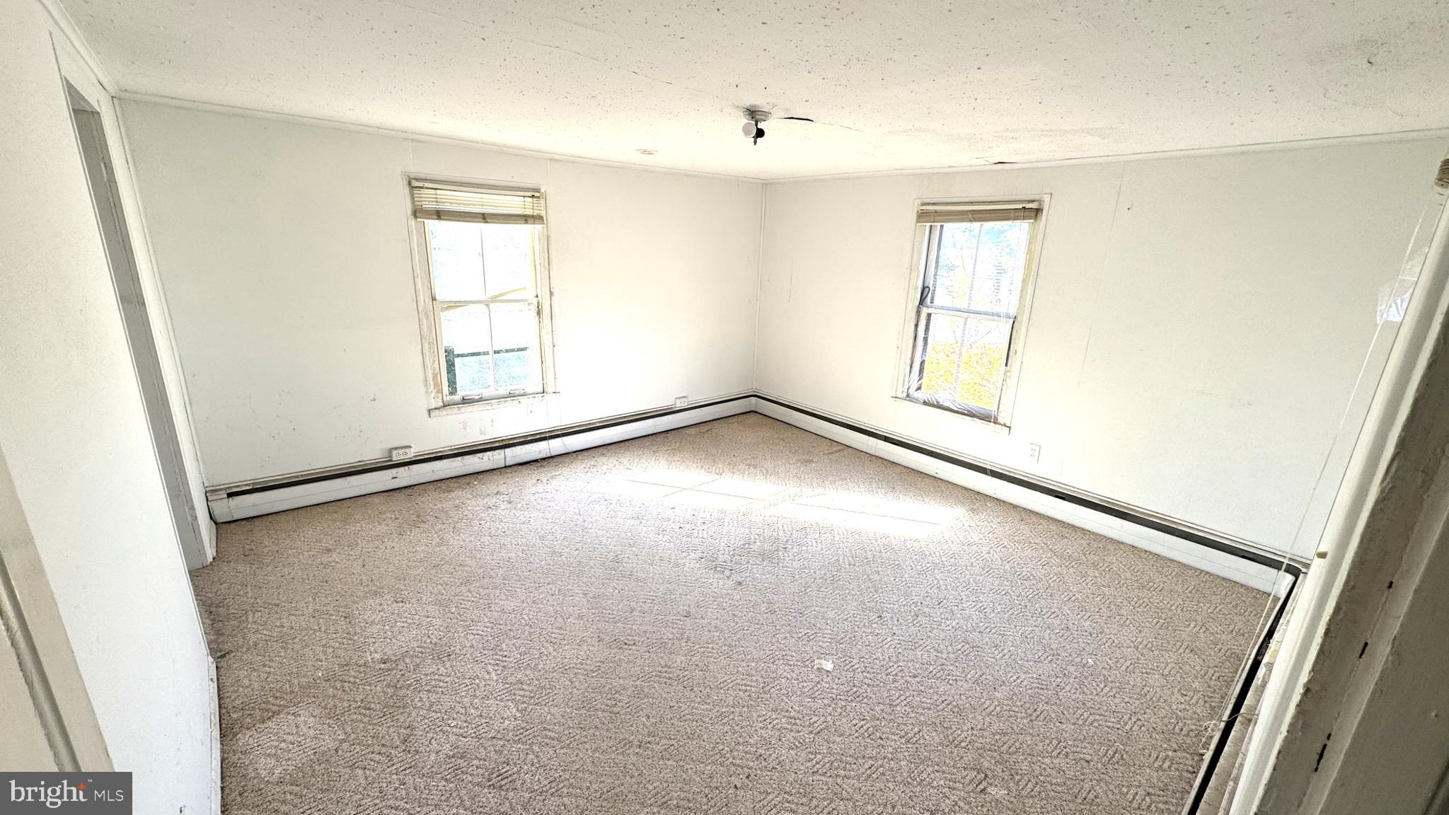 28207 Nanticoke Road Salisbury, MD 21801 - Photo 11 of 26 an empty room with windows