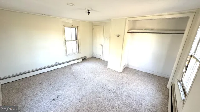 a view of a room with windows