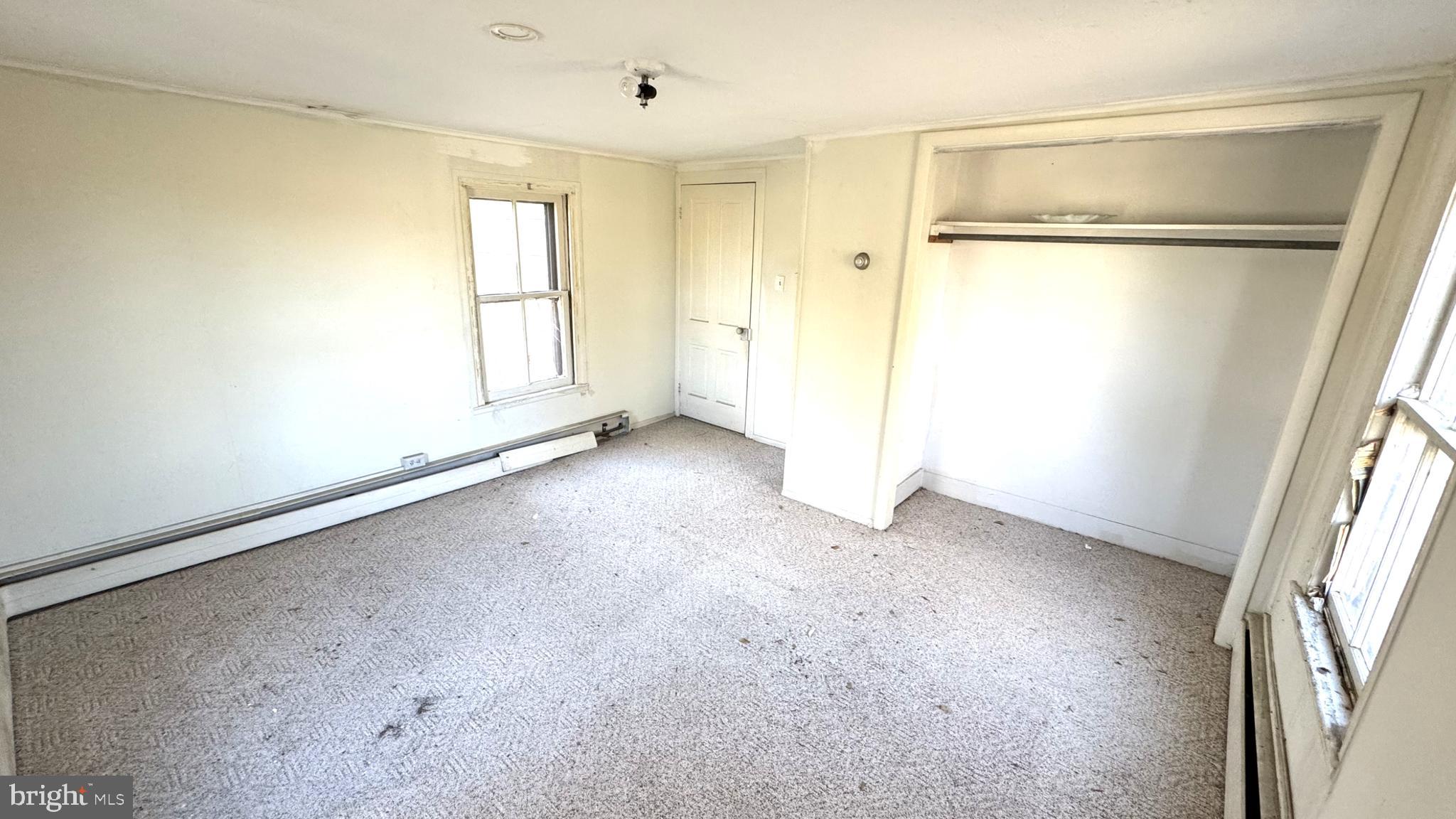 28207 Nanticoke Road Salisbury, MD 21801 - Photo 13 of 26 an empty room with windows and closet