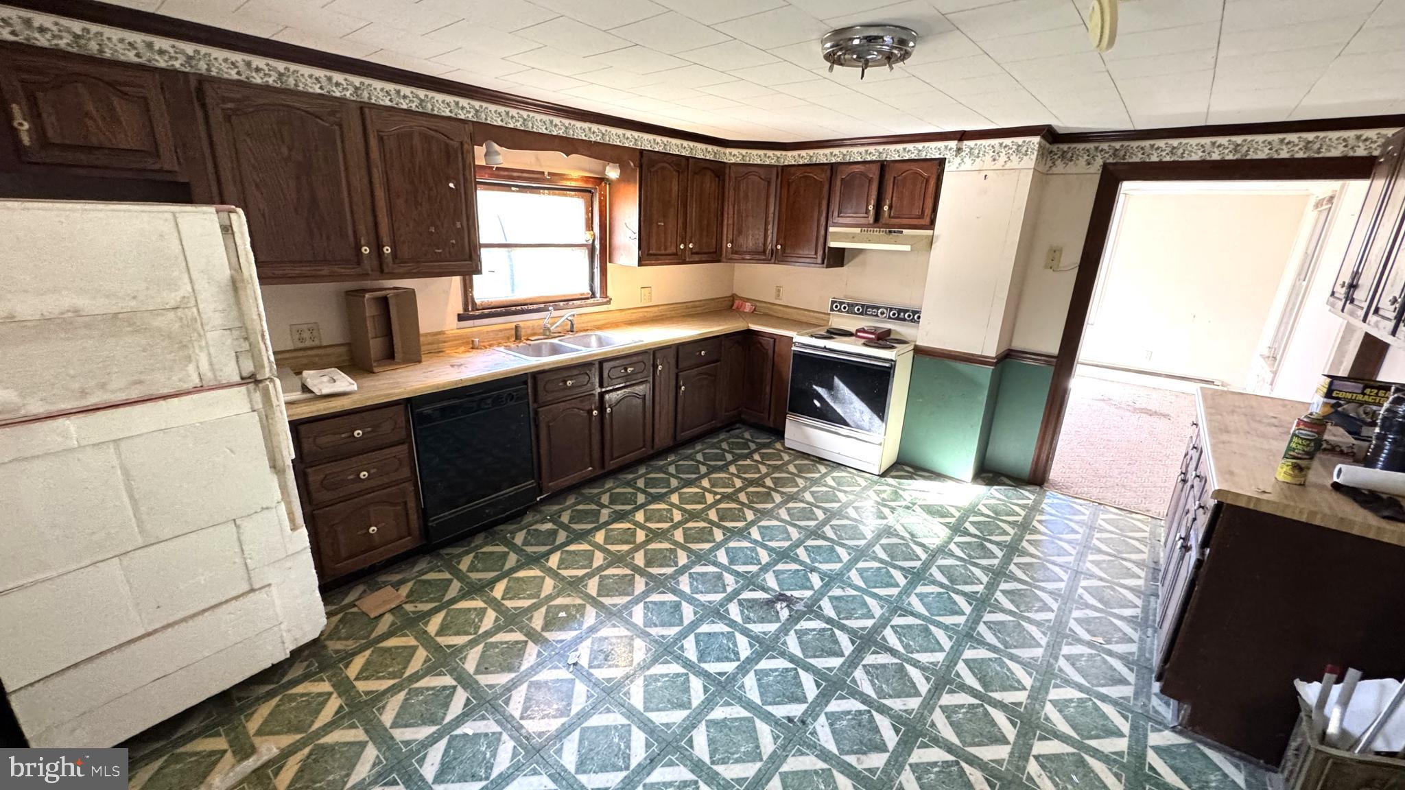 28207 Nanticoke Road Salisbury, MD 21801 - Photo 6 of 26 a kitchen with a sink appliances and cabinets