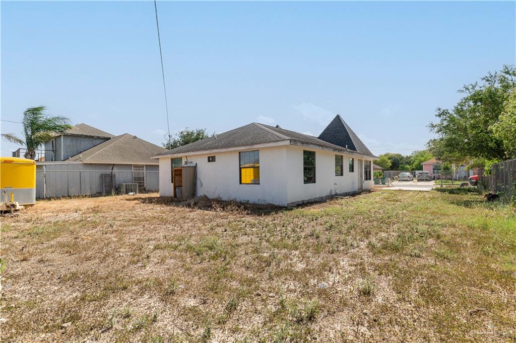 6707 South Rivera Street Pharr, TX 78577 - Photo 16 of 17 Rear view of property featuring stucco siding