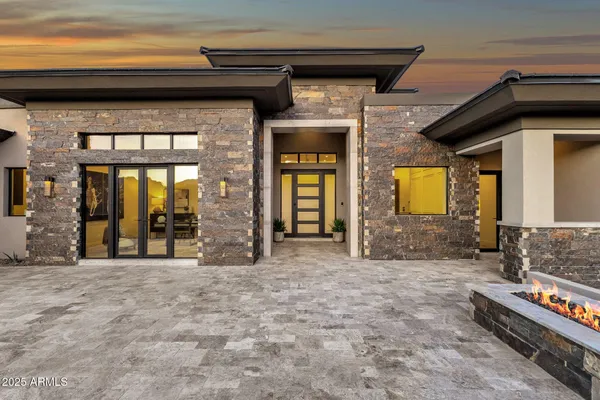a kitchen with a table chairs stove and cabinets