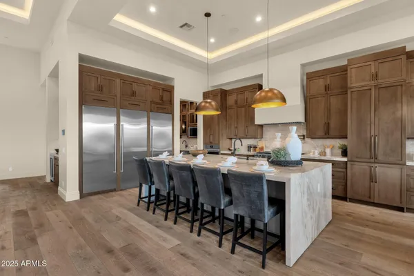 a bathroom with a granite countertop sink mirror and toilet