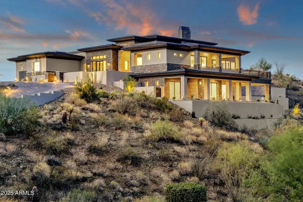 a view of a swimming pool with a yard