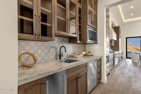 a bedroom with a large bed and a large window