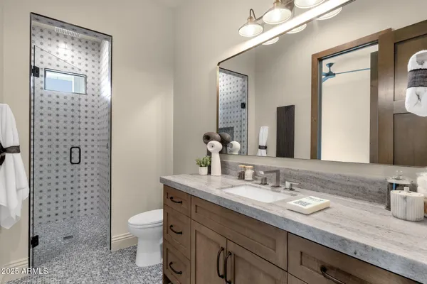 a view of a swimming pool with a lounge chair and floor to ceiling window