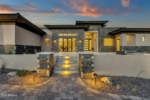 a view of a house with porch and furniture