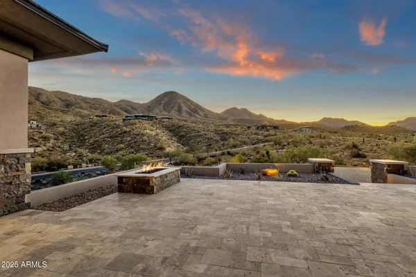 a living room with kitchen island furniture and a chandelier