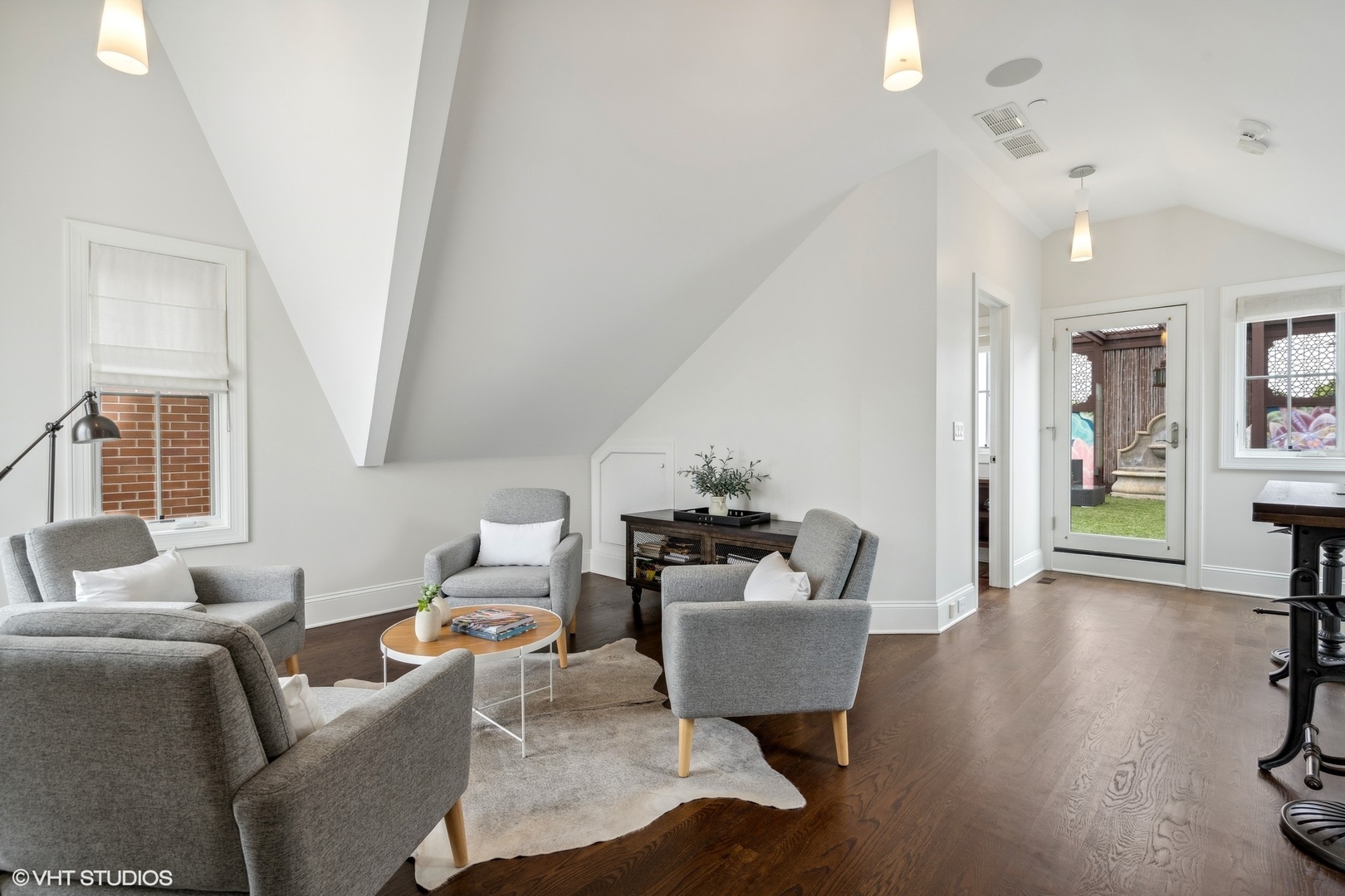 3740 North Wayne Avenue Chicago, IL 60613 - Photo 32 of 55 a living room with furniture and a wooden floor