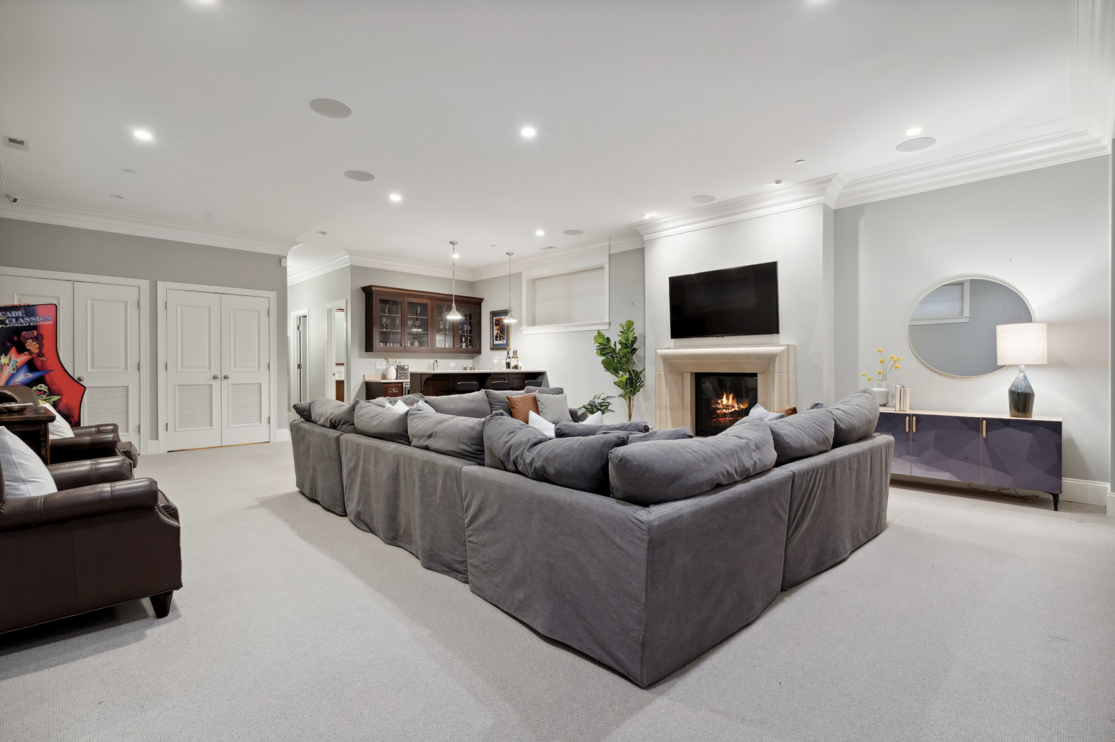 3740 North Wayne Avenue Chicago, IL 60613 - Photo 36 of 55 a living room with furniture a flat screen tv and a fireplace