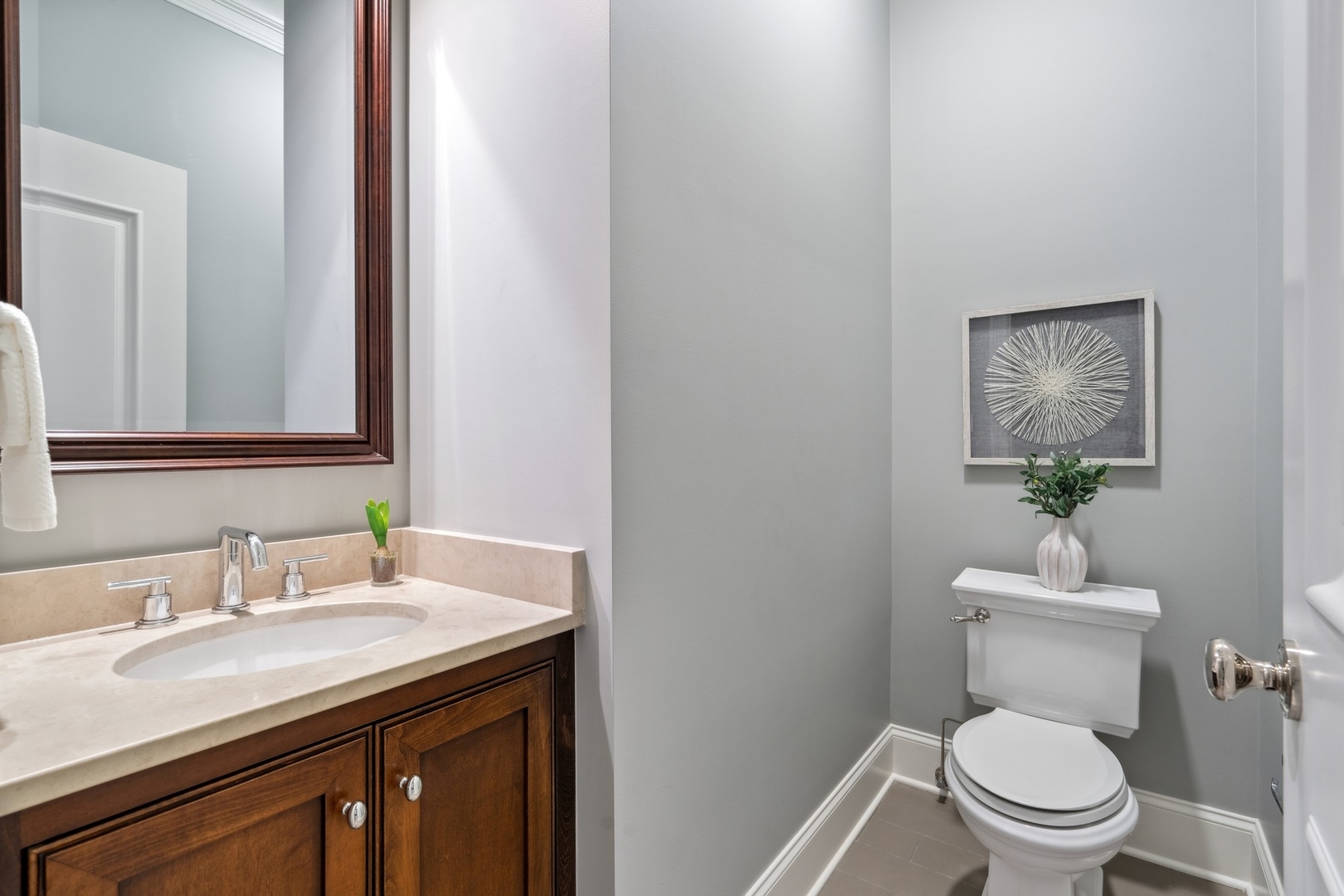 3740 North Wayne Avenue Chicago, IL 60613 - Photo 40 of 55 a bathroom with a granite countertop toilet sink and mirror