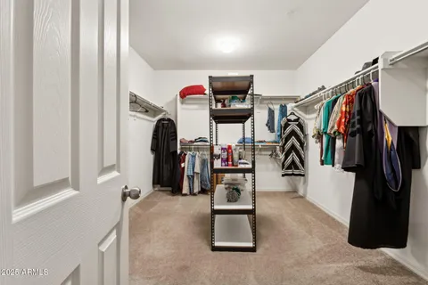 a living room with furniture and a ceiling fan