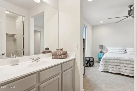 a bathroom with a sink a mirror and a toilet