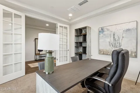 a dining room with furniture and wooden floor