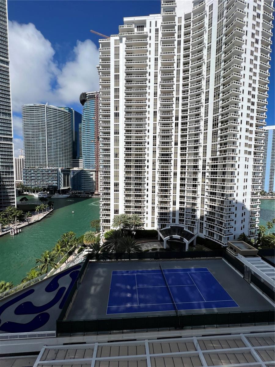 801 Brickell Key Boulevard, Unit 1506 Miami, FL 33131 - Photo 15 of 23 a front view of a house with a yard