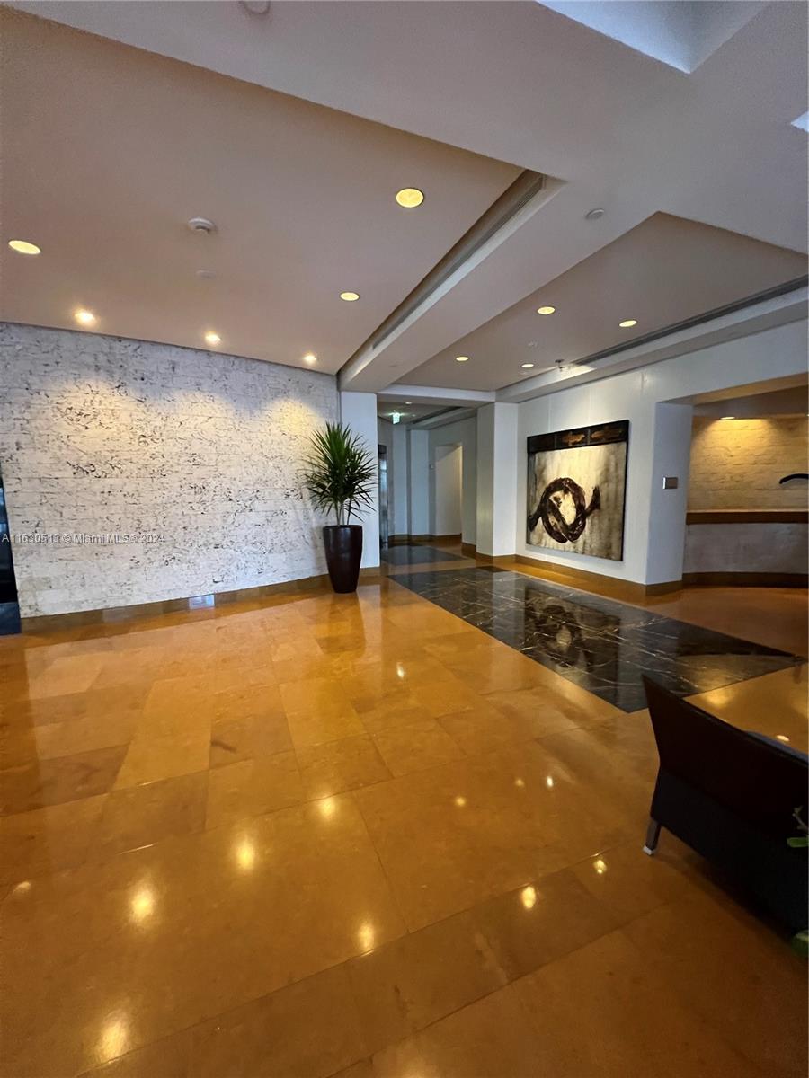 801 Brickell Key Boulevard, Unit 1506 Miami, FL 33131 - Photo 2 of 23 a view of an empty room with a window and fireplace