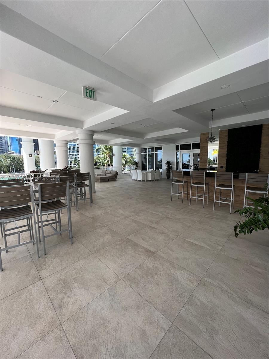 801 Brickell Key Boulevard, Unit 1506 Miami, FL 33131 - Photo 22 of 23 a room with lots of furniture and a view of living room