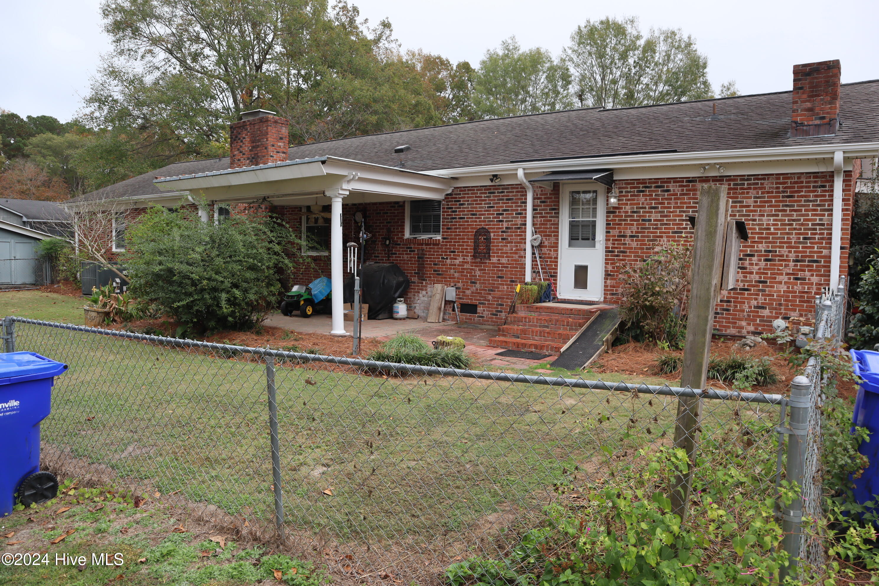 313 Prince Road Greenville, NC 27858 - Photo 30 of 31 Rear of dwelling showing Covered Patio and chain link fence