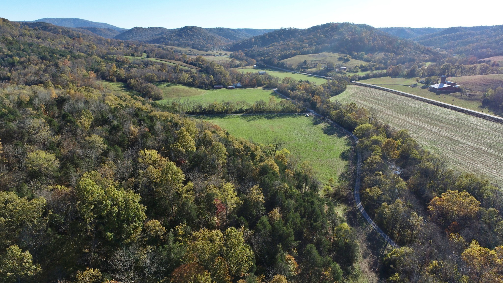 0 Sweetwater Road Liberty, TN 37095 - Photo 11 of 16 a view of a lush green hillside and houses