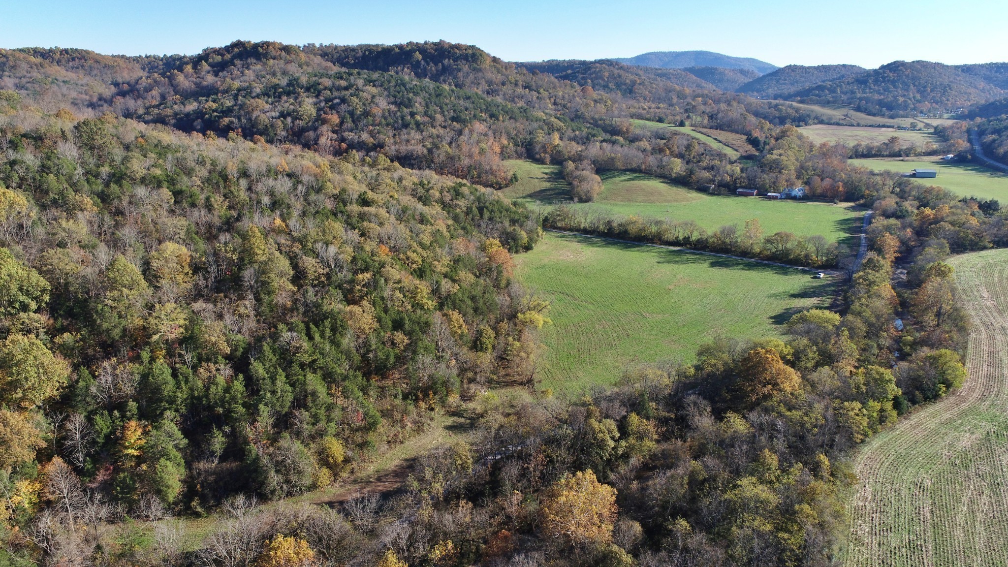 0 Sweetwater Road Liberty, TN 37095 - Photo 10 of 16 a view of a lush green hillside and a building