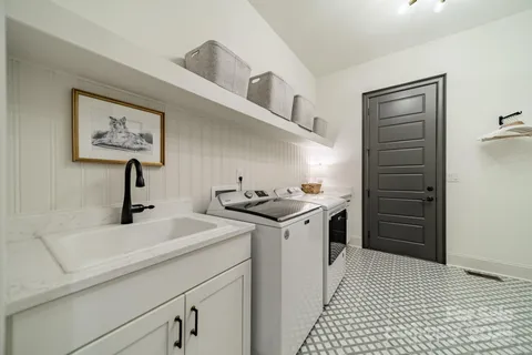 a view of a hallway view with cabinets