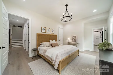 a bedroom with a bed and ceiling fan