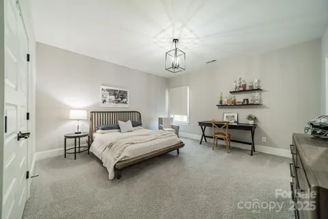 a bathroom with a toilet a sink and a mirror