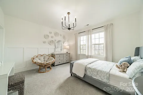 a bedroom with a bed and dresser