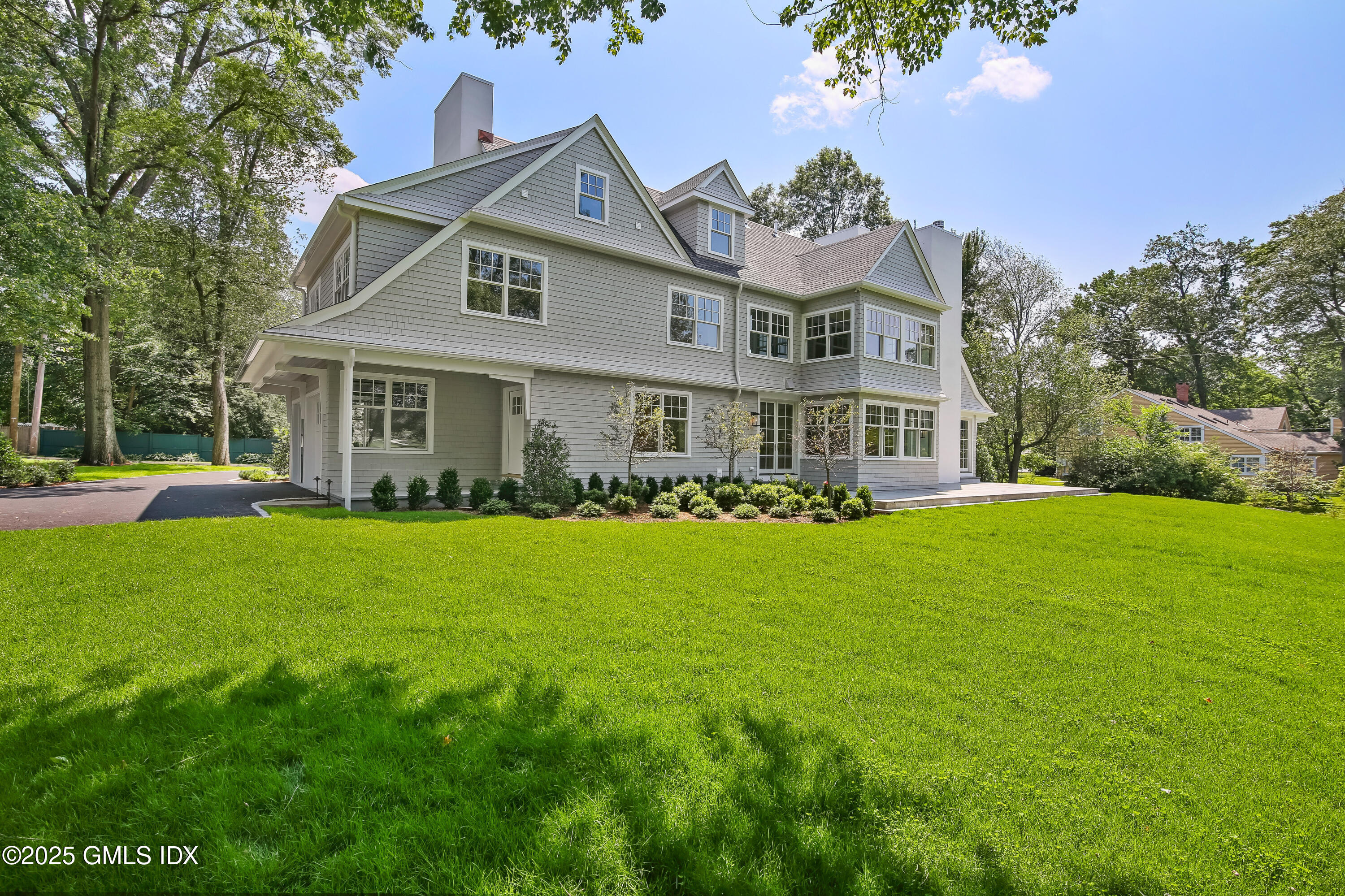 11 Morningside Drive Greenwich, CT 06830 - Photo 12 of 13 a front view of house with yard and green space