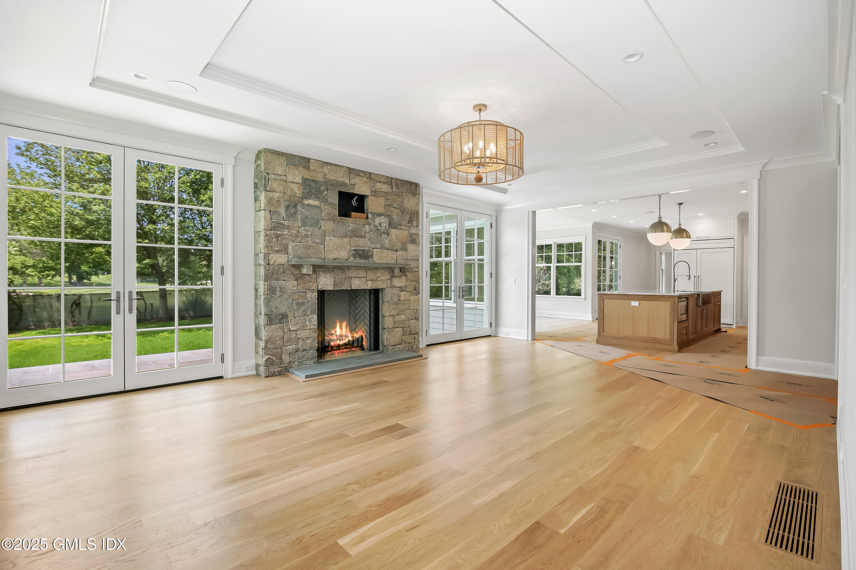 11 Morningside Drive Greenwich, CT 06830 - Photo 4 of 13 a view of a livingroom with a fireplace wooden floor and window