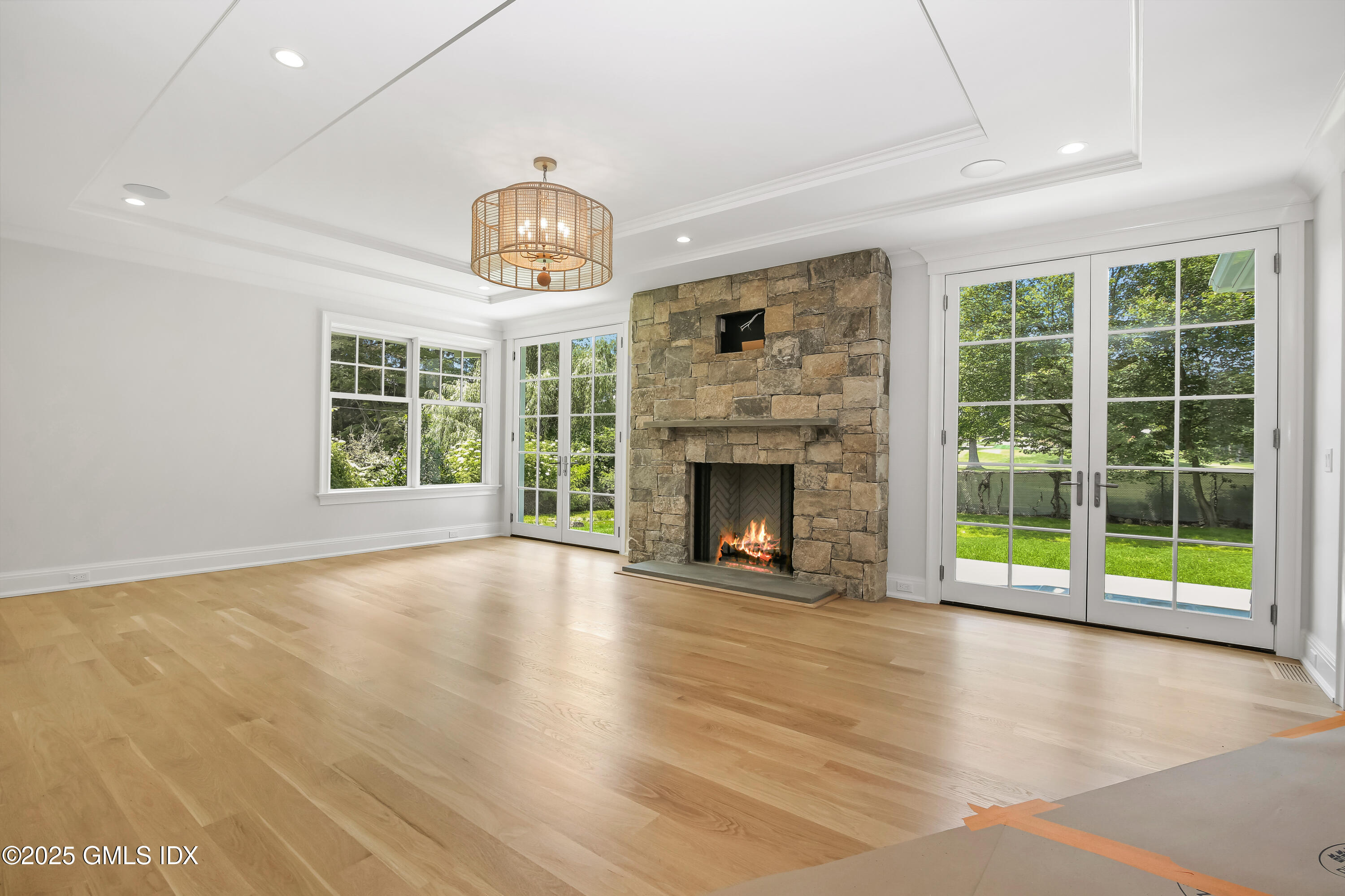 11 Morningside Drive Greenwich, CT 06830 - Photo 5 of 13 a view of an empty room with a fireplace and a window