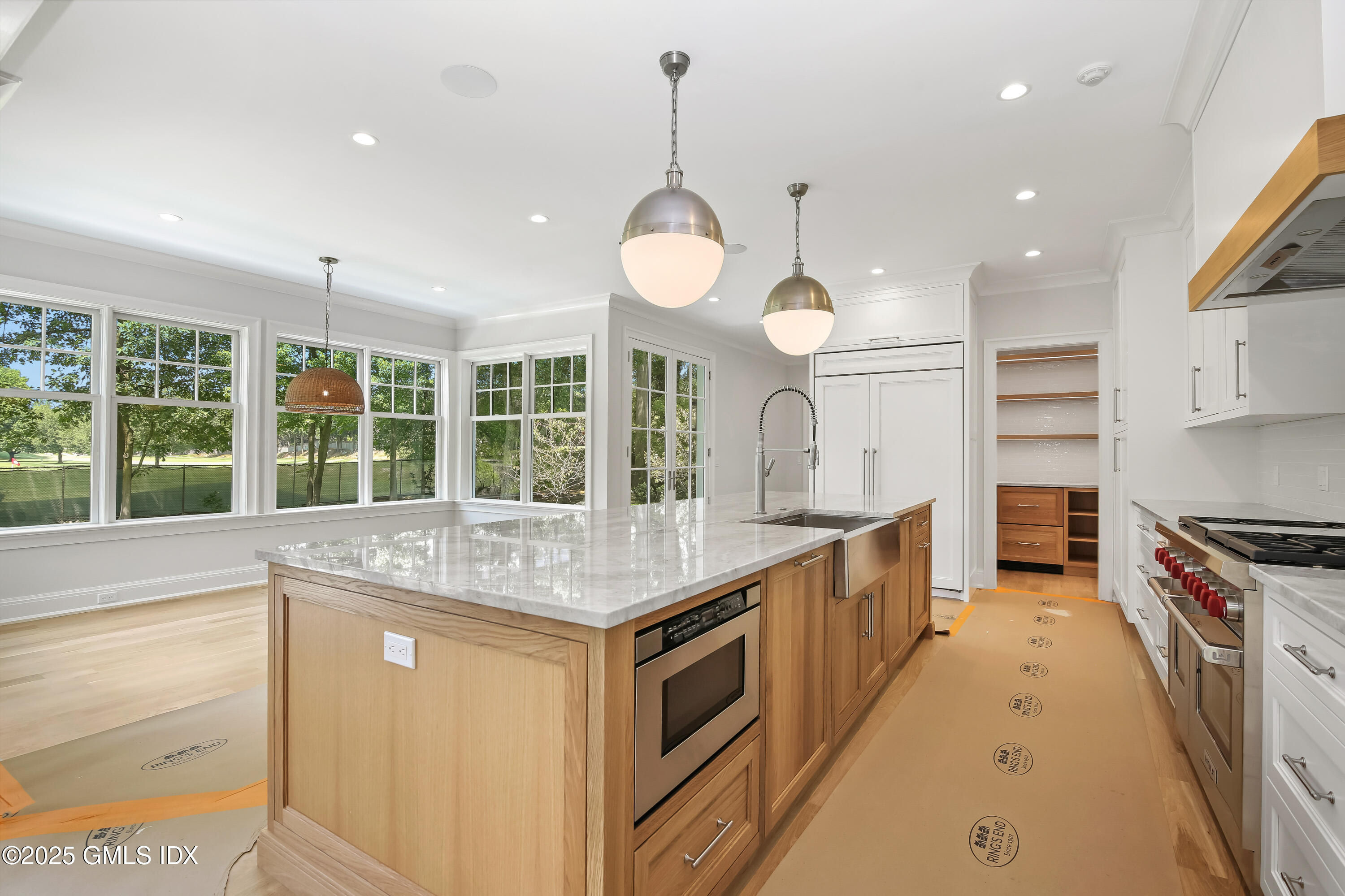 11 Morningside Drive Greenwich, CT 06830 - Photo 6 of 13 a kitchen with kitchen island granite countertop a stove a sink a refrigerator and a wooden floors