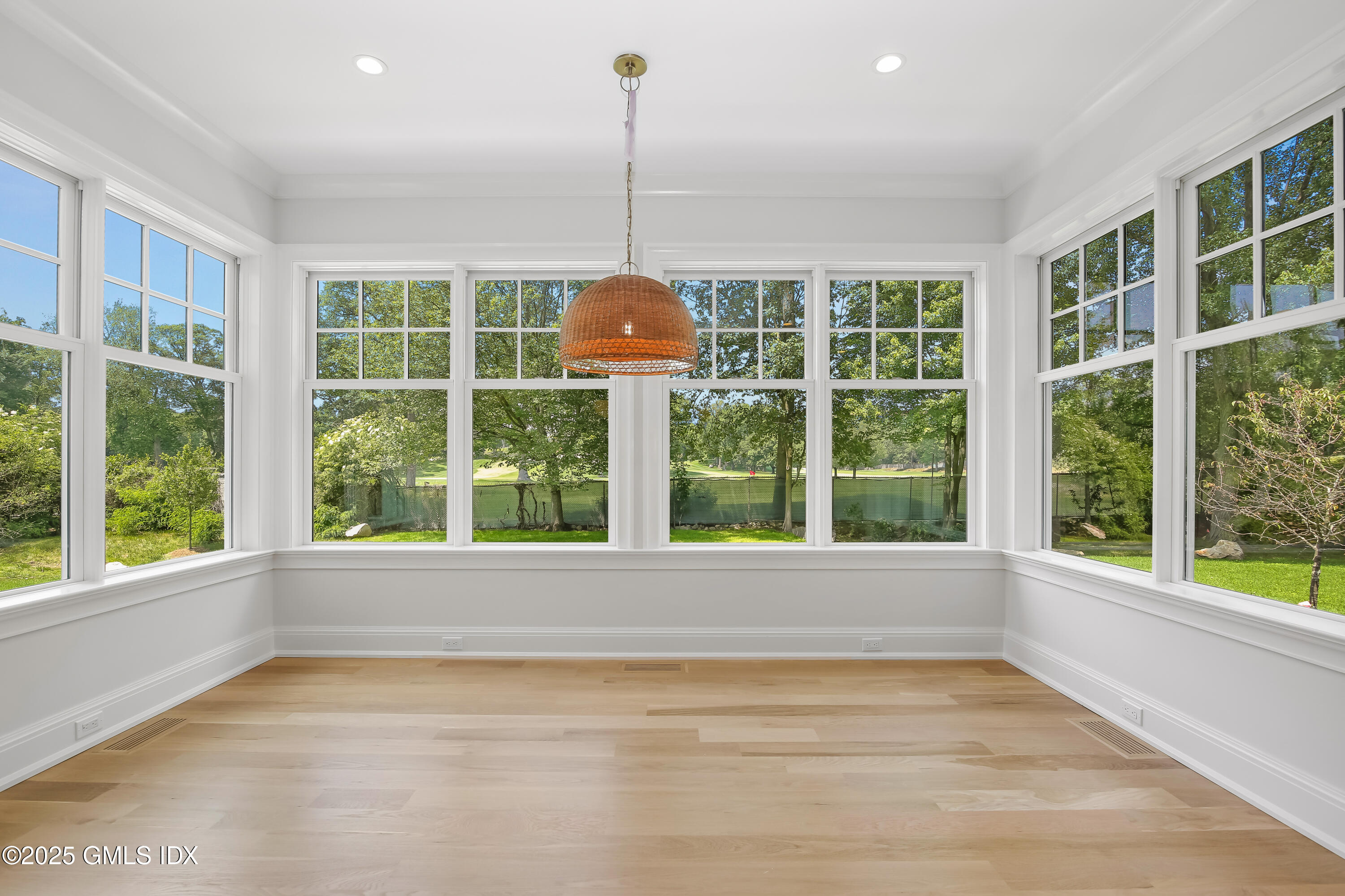 11 Morningside Drive Greenwich, CT 06830 - Photo 7 of 13 a view of an empty room with a window and wooden floor