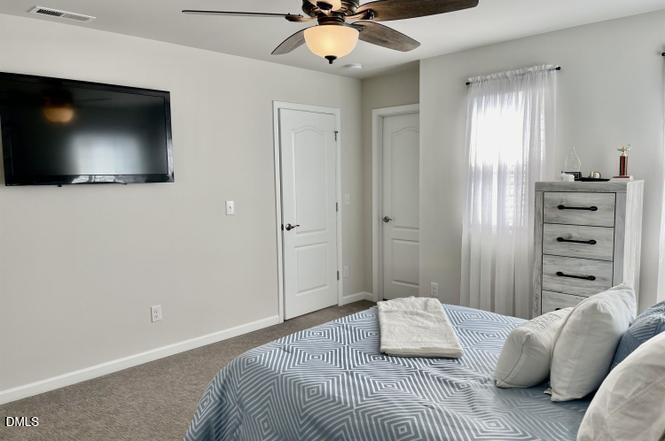 1807 Wrenn Road Durham, NC 27703 - Photo 37 of 43 a bedroom with a bed and a television