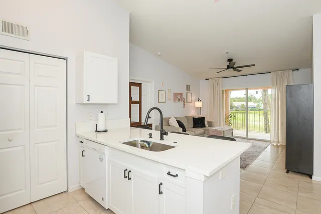 a view of a kitchen with refrigerator