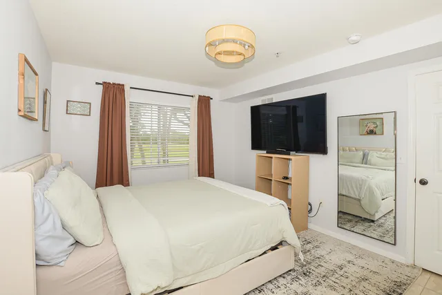 a bedroom with a bed and a cabinets