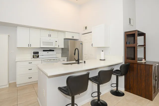 a view of a kitchen and dining room
