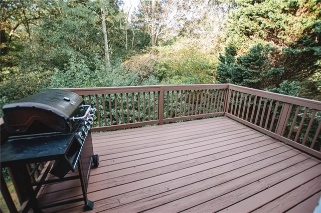 a view of balcony with wooden floor